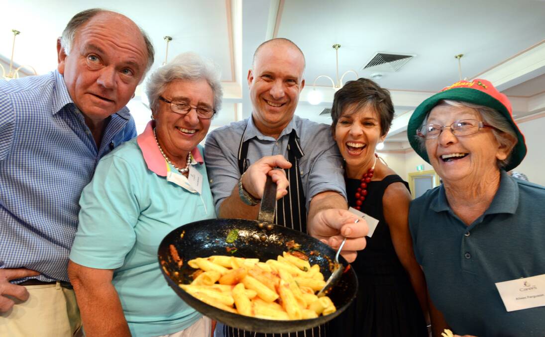 CARING AND SHARING: From left, carers George Capel and Gloria McDouall, executive chef Ben Davies, Elena Katrakis of Carers NSW and carer Aileen Ferguson. Photo: Barry Smith 181213BSC02