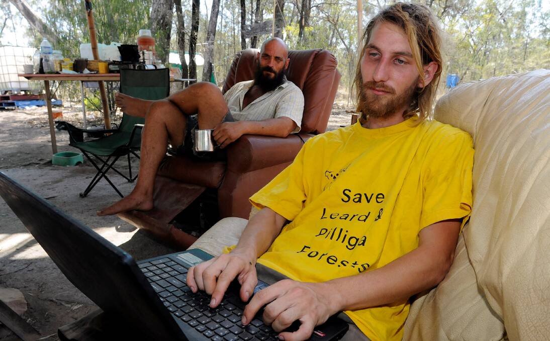 ‘NOT GUILTY’: Activist Jonathan Moylan, front, denies protesters linked to the Front Line Action on Coal camp, which he founded with Murray Drechsler, back, in the Leard State Forest are behind acts of vandalism at the Boggabri Coal mine.