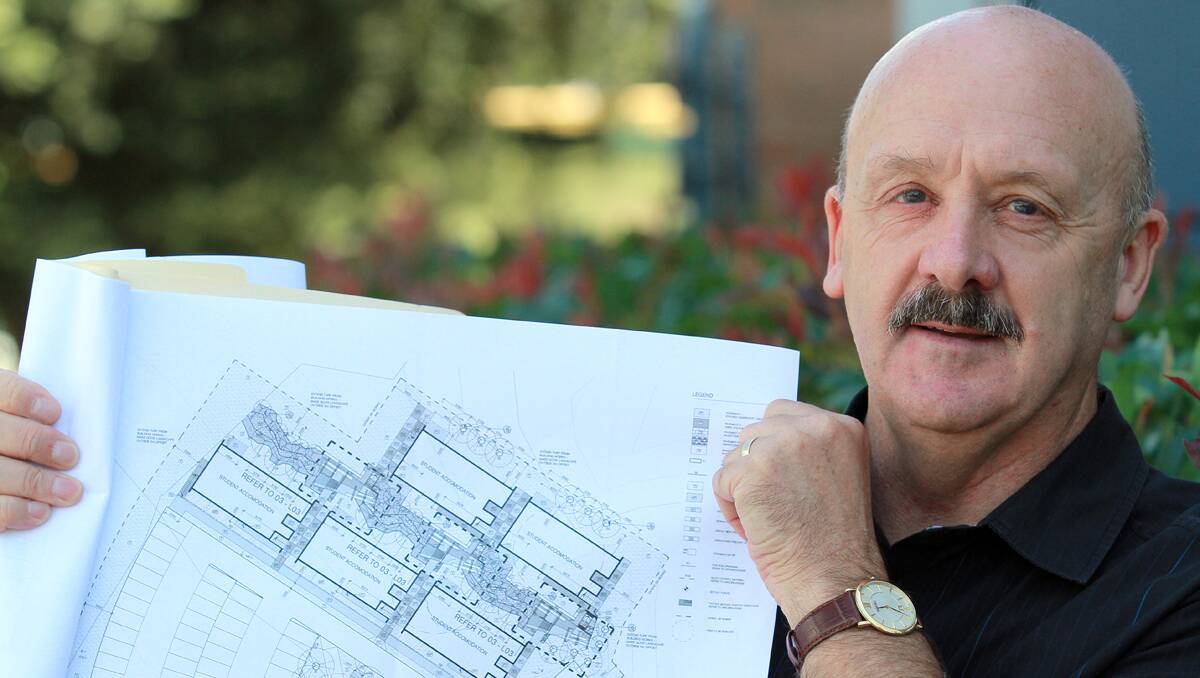 NEW BEGINNINGS: Trevor Gerdsen with plans for the new Tamworth Education Centre as part of the University of  Newcastle’s Department of Rural Health. Photo: Robert Chappel 210213RCA04