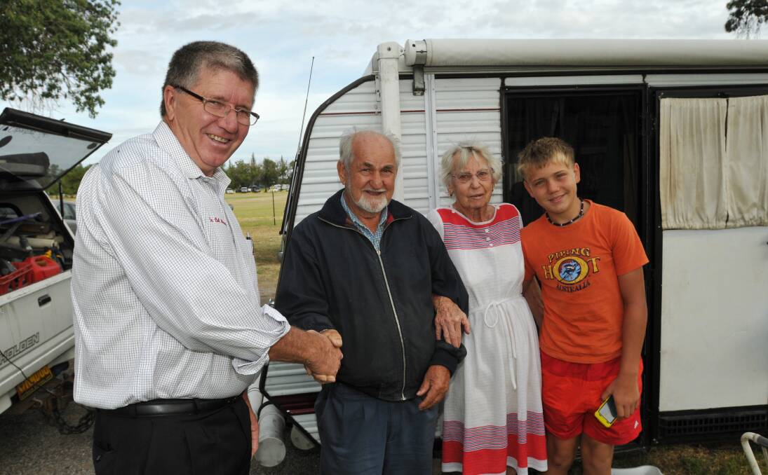 COME ON IN: Mayor Col Murray welcomes Ray and Mary Dryden and  12-year-old Jaiden Holly from Brisbane. 090114GOA01
