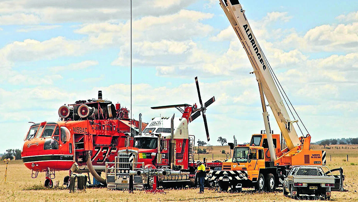 CRANE HELPS AIR-CRANE: Camille the air-crane has left the Tamworth district after receiving repairs in an Attunga paddock this week. Photo courtesy Ray Woods