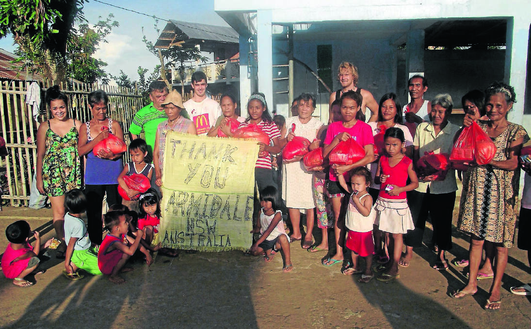 DEEP APPRECIATION: Villagers in typhoon-hit Panay Island thank Armidale residents for raising money to help in the rebuilding effort.