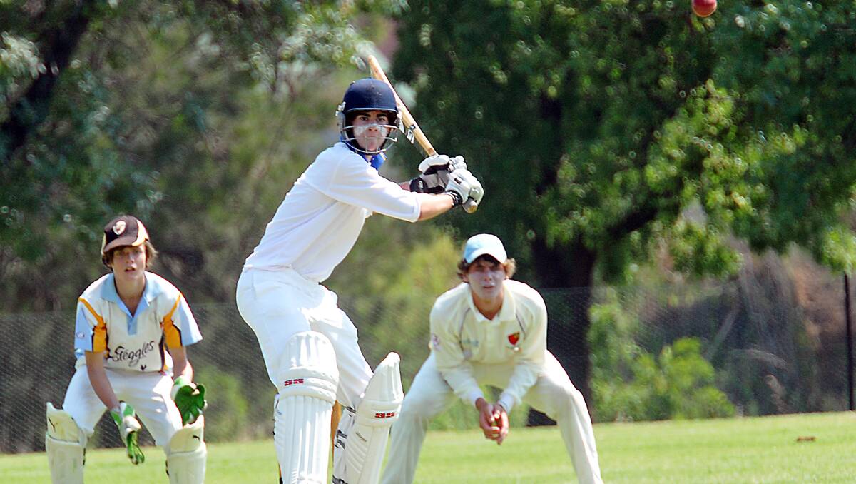 Jayden Park prepares to pull this delivery for the Bradman Cup side against an Invitational XI side containing wicketkeeper Matt Hughes and first slip Matt Everett.  Photo: Geoff O’Neill 091212GOB03