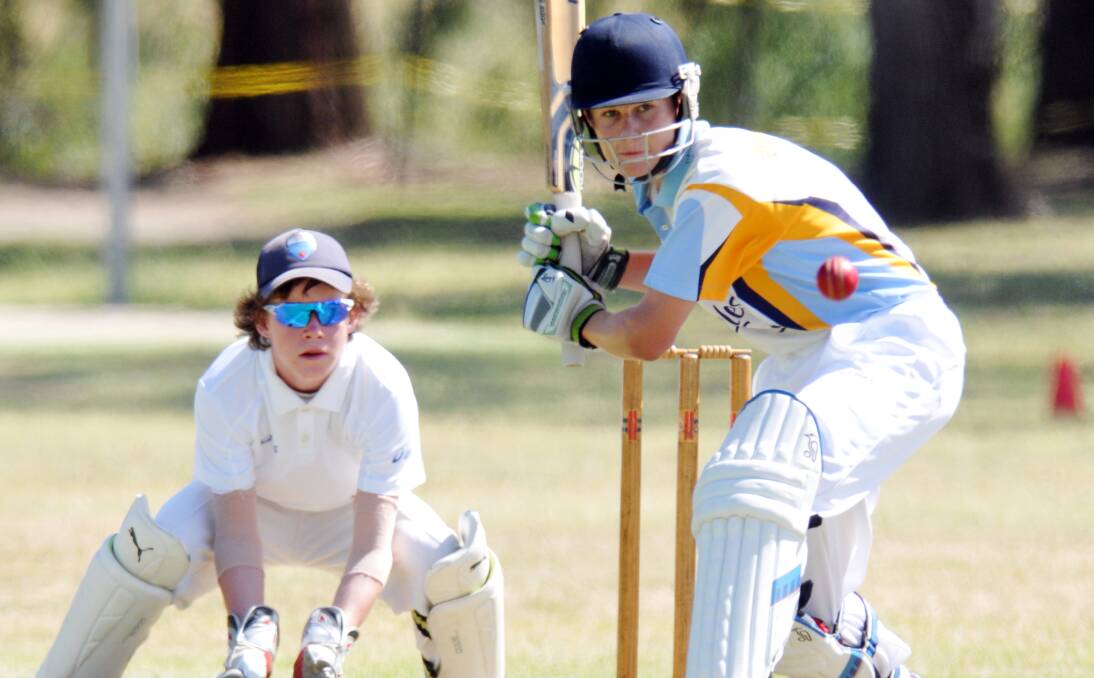 Narrabri’s Coby Cornish readies behind the stumps as Tamworth’s Toby Whale looks to drive during last week’s  Tamworth Invitational carnival. The two are team-mates this week and helped Central North get off to a winning start at the Kookaburra Cup yesterday. Photo: Geoff O’Neill 070114GOA06