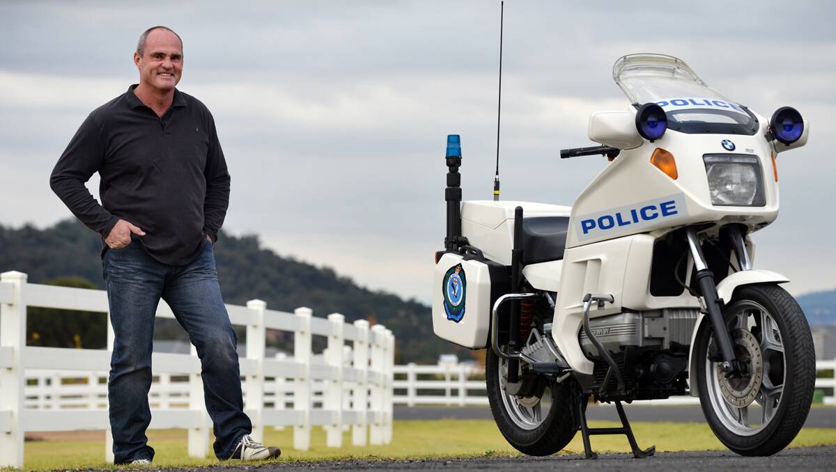 SATISFACTION: Gordon Guyer is pleased with the way the BMW police bike has come up after his careful  restoration. Photo: Barry Smith 230513BSE04