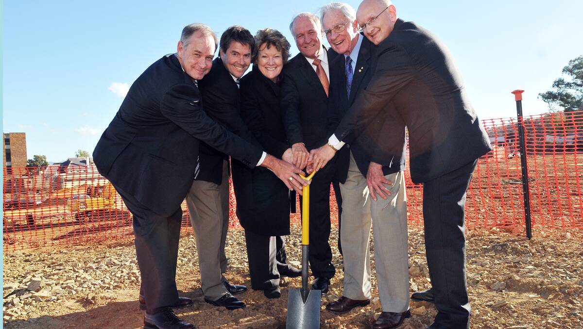 JOINT PROJECT: From left, Tamworth hospital general manager Brad Hansen, Tamworth MP Kevin Anderson, NSW Health Minister Jillian  Skinner, New England MP Tony Windsor, hospital patron Alec Noble and federal parliamentary secretary for health Shayne Neumann turn the first sod at the construction site of the future acute services building. Photo: Geoff O’Neill 050713GOD08