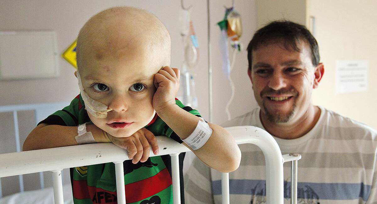 HOPE FLOATS: Tamworth toddler Bailon Johnson and his dad Randy at Newcastle’s John Hunter Hospital. Bailon has recently undergone a barrage of operations but doctors say he still only has a 50 per cent chance of survival.