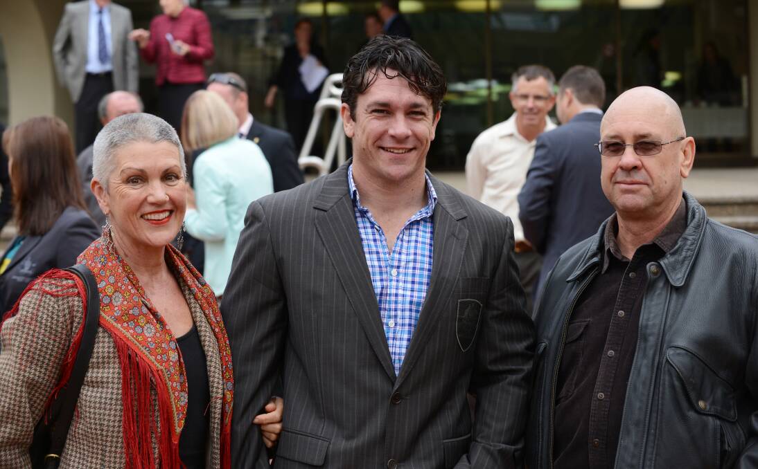 Duncan Harvey with his parents Elizabeth Arthur and David Harvey at the opening ceremony of the Tamworth Olympic Wall in August last year.  Photo: Barry Smith  020813BSB08