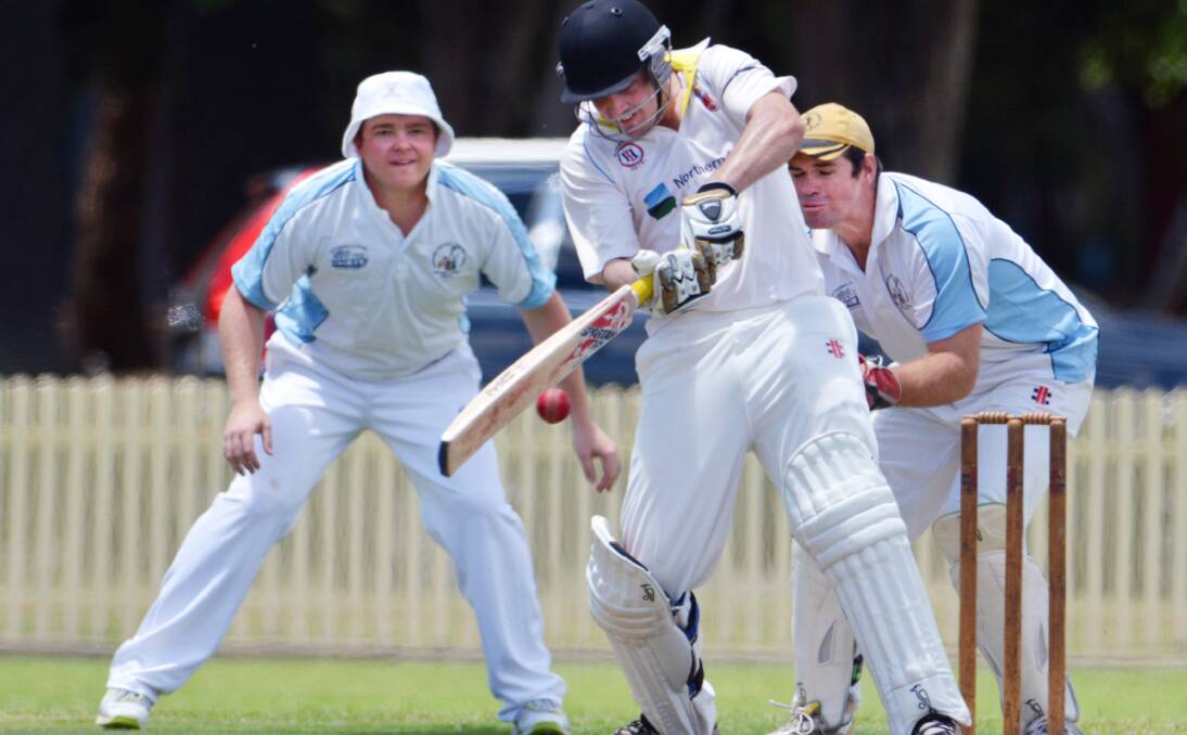 Tamworth opener Michael Rixon cuts during his unbeaten 40 as Narrabri skipper Lachlan Cameron (keeping) and Luke Meppem look on.  Photo: Barry Smith 011213BSE42