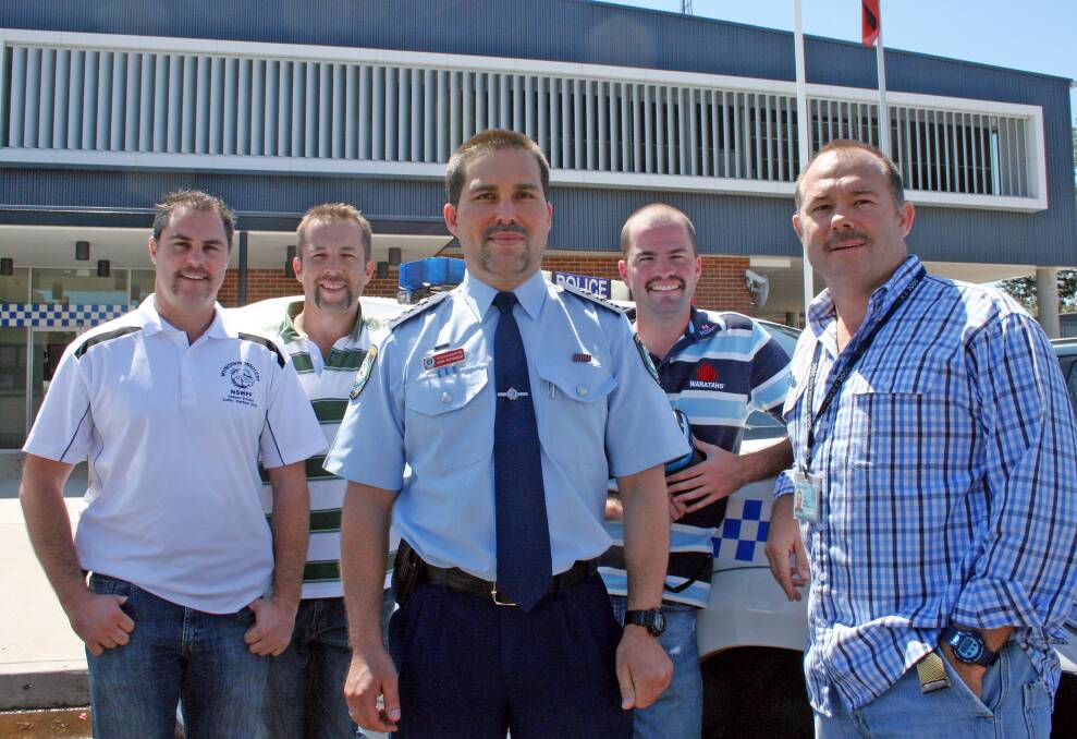 DEFECTIVE DETECTIVES: Detective Inspector Gavin Rattenbury, centre, flanked by, from left, team members Tim McCarthey, Clint Oxenbridge, Dave Marr and Paul Edwards are part of the Moree Movember movement. Photo: Bill Poulos
