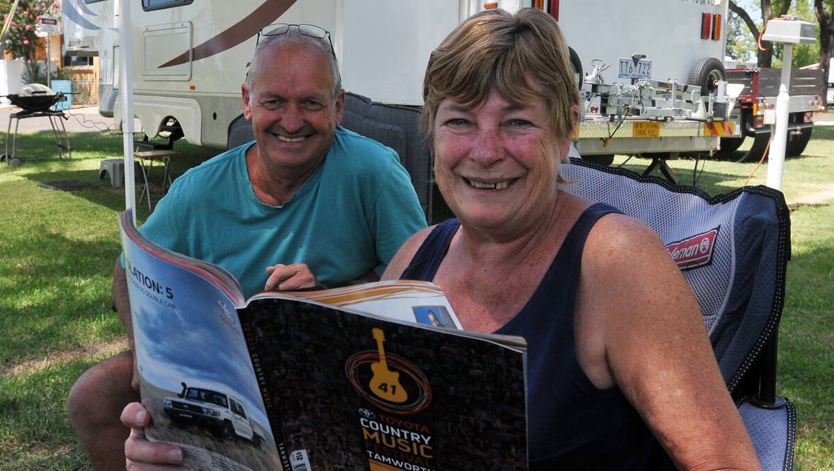 FIRST-TIMERS: Ross and Julie Riddell are reading up on festival events before the event kicks off. Photo: Geoff O’Neill 010113GOC01