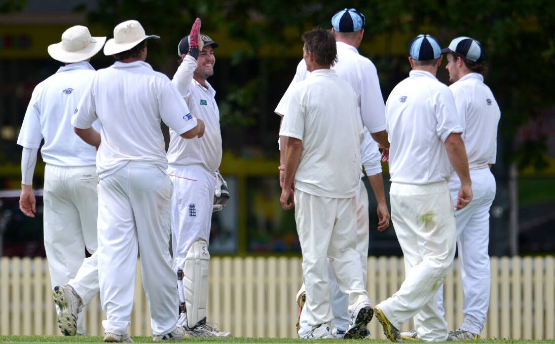 Tom Groth high-fives South Tamworth and Tamworth bowling teammate Col Smyth after a recent success.  Photo: Barry Smith 160213BSD29