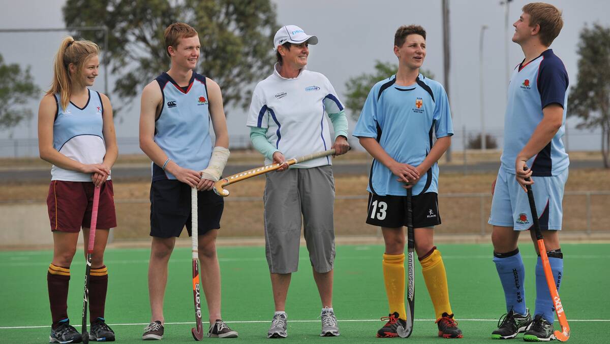 Newly-selected State U15 indoor representatives (from left) Alice Arnott, Isaac Farmilo, Antony Doolan and Andrew Finch were back in outdoor mode yesterday as they participated in a session run by NSWIS coach Judy Laing (centre).    Photo: Barry Smith 261212BSH05
