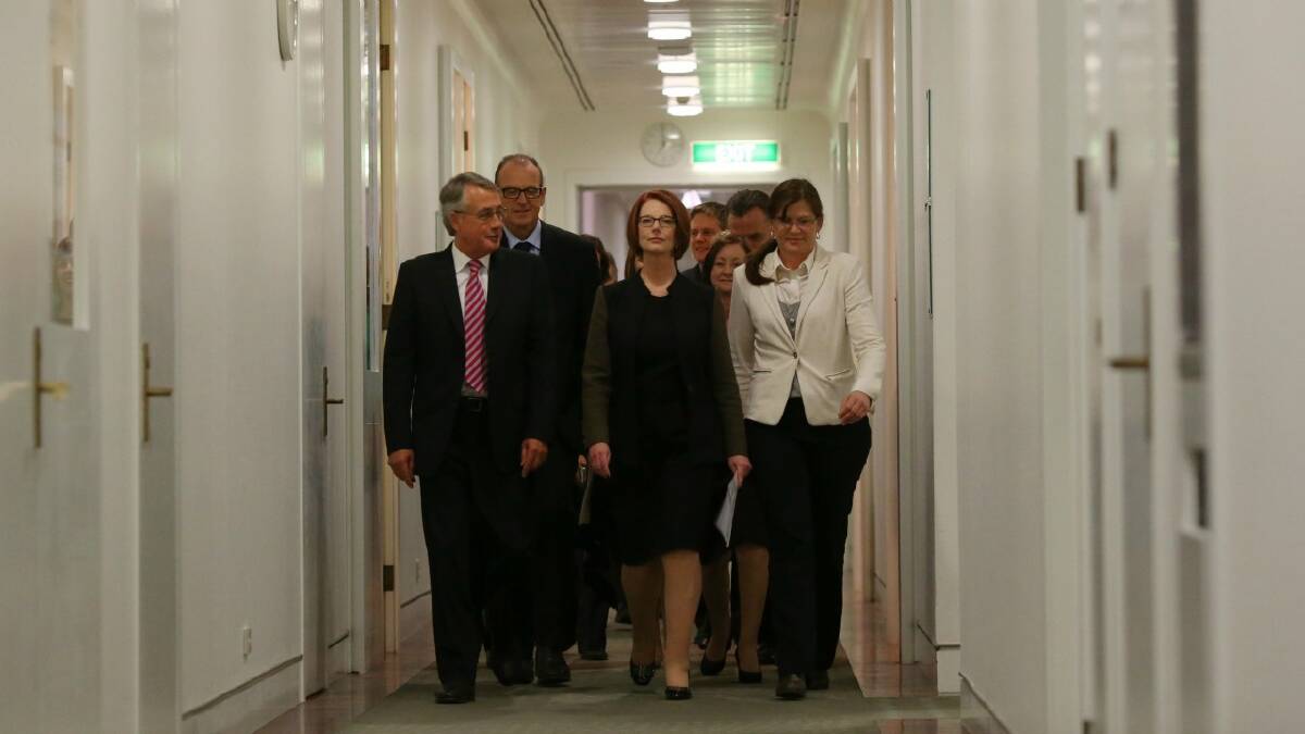 Julia Gillard, flanked by supporters, makes her way to the leadership showdown. Click or swipe through the gallery to remember memorable moments from the current parliament.  