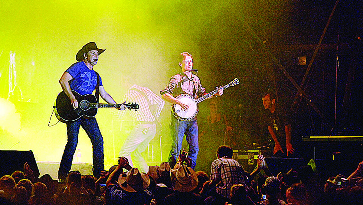 Country music star Lee Kernaghan and local musician Lawrie Minson during the 2010 Tamworth Country Music festival.