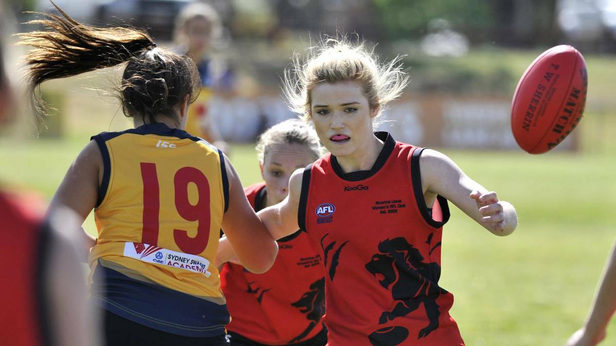 Riverina's Scarlett Campbell (right) keeps her eye on the ball as Sydney's Amy Jones comes in to make a contest in the Youth Girls State Cup at Maher Oval. Picture: Les Smith