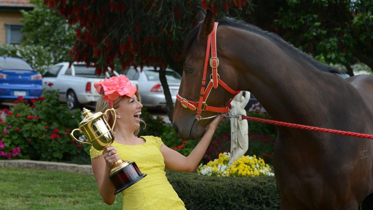 Stacey Lonsdale, dressed by Myer, with Churchill Express and the Bendigo Cup. Picture: Jim Alderssey