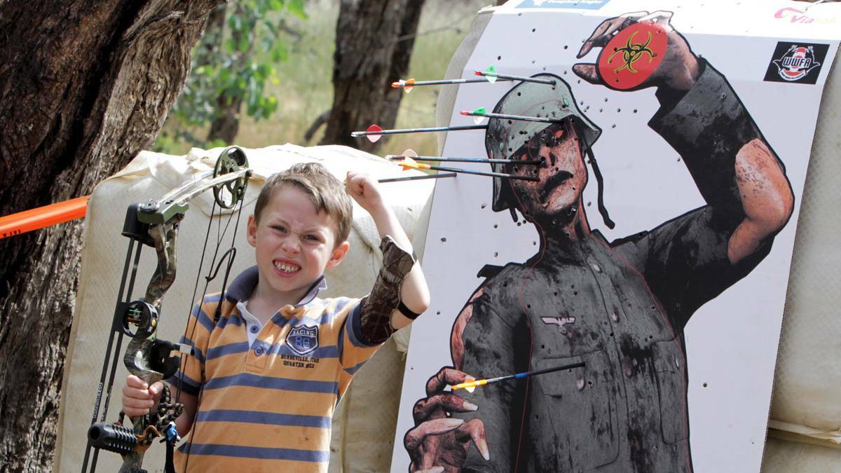 Ryan Sims, 6, of Ladysmith celebrates after taking out his target in the Wagga Field Archers shoot at Wokolena Road range. Picture: Les Smith