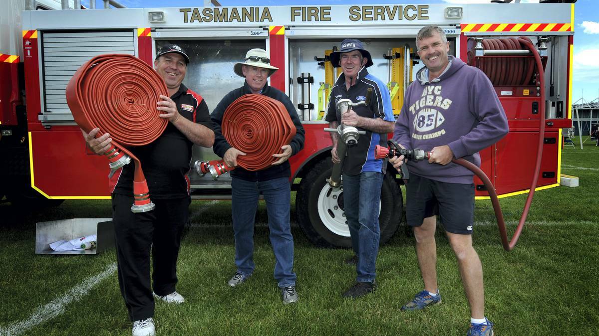 Shane Kearney, Russell Deans, Graham Gibbons and Ray Dresser, all of Kelso in NSW, at the practice day for the Australian Fire Fighting Championships. Picture: Geoff Robson