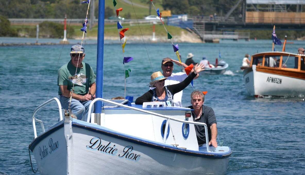One of the Narooma BoatsAfloat traditional boat festival organisers Mark Westwood on his boat Dulcie Rose that is currently being refurbished by the Narooma Wooden Boat Centre.