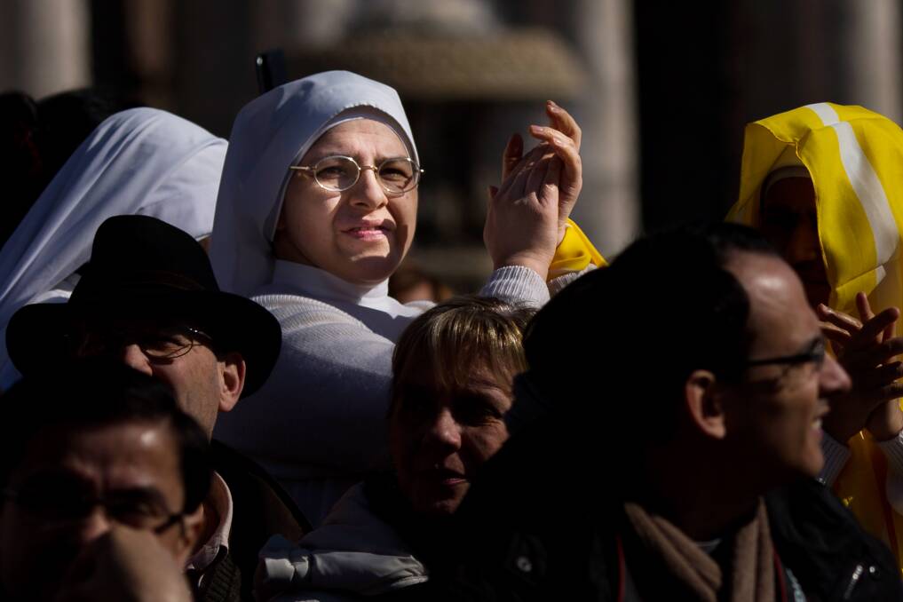 Nuns wait in the crowd for the arrival of Pope Benedict XV in St Peter's Square in Vatican City. Photo by Carsten Koall/Getty Images