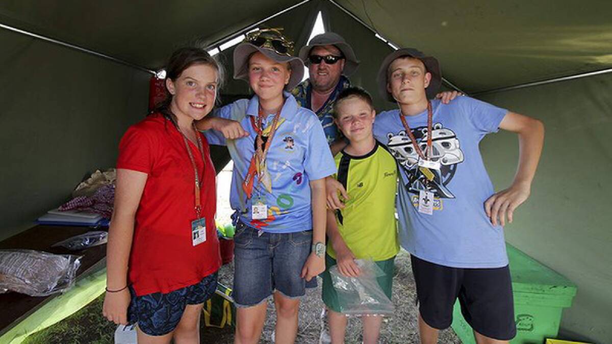 Caitlyn Fussell, 13, Laura Moore, 13, scout leader Gavin Moore, Matthew Kirton, 12, and Simon Cottee, 14, from Nepean District scouts, NSW, at their campsite. Photo: Michelle Smith