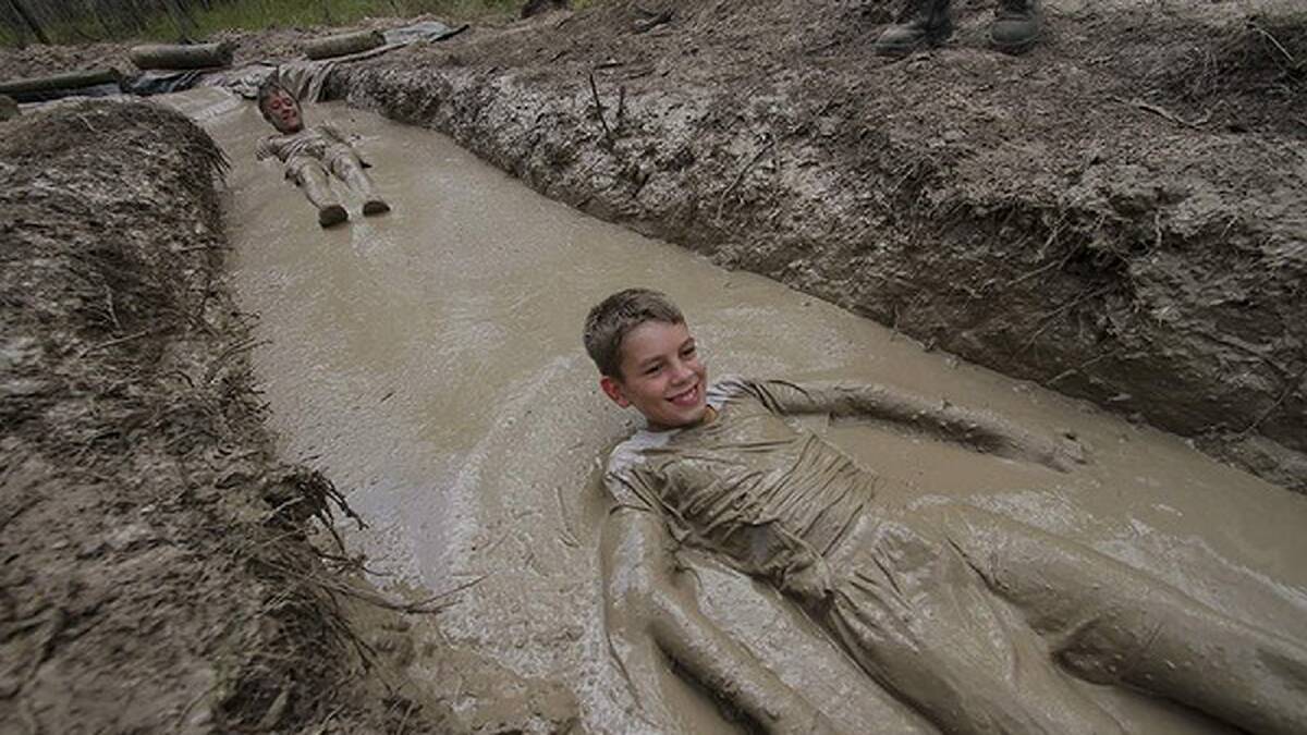 Reece Williams, 12, from Alice River, Townsville QLD - in the mud obstacle course. Photo: Michelle Smith
