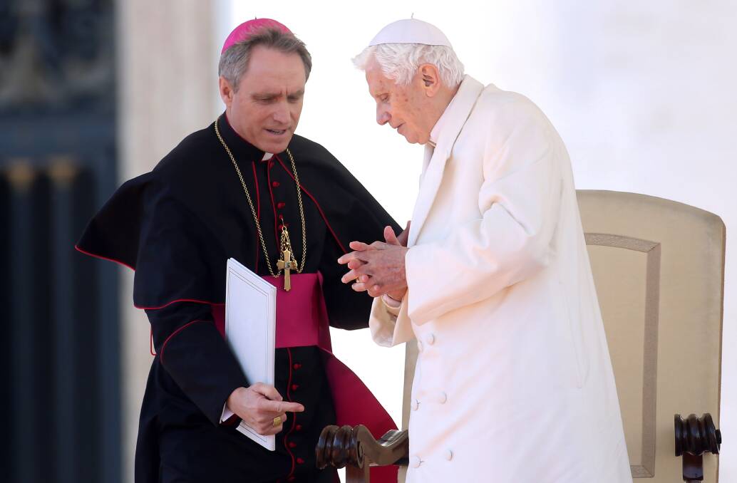 Pope Benedict XVI flanked by his personal secretary Georg Ganswein, attends his final general audience in St. Peter's Square in Vatican City. Photo by Franco Origlia/Getty Images