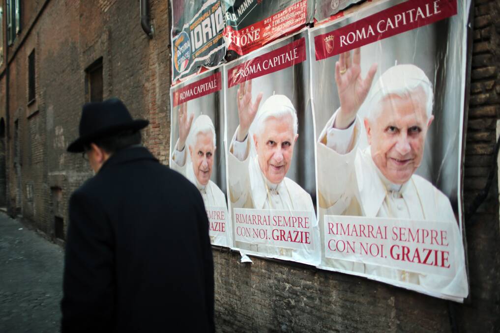 Posters wish Pope Benedict XVI farewell after giving his final general audience in St Peter's Square before his retirement in Vatican City. Photo by Christopher Furlong/Getty Images