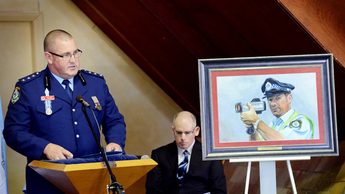 Inspector Jeff Budd addresses a crowd gathered at Manilla for Police Remembrance Day in September. 270913GGCC02