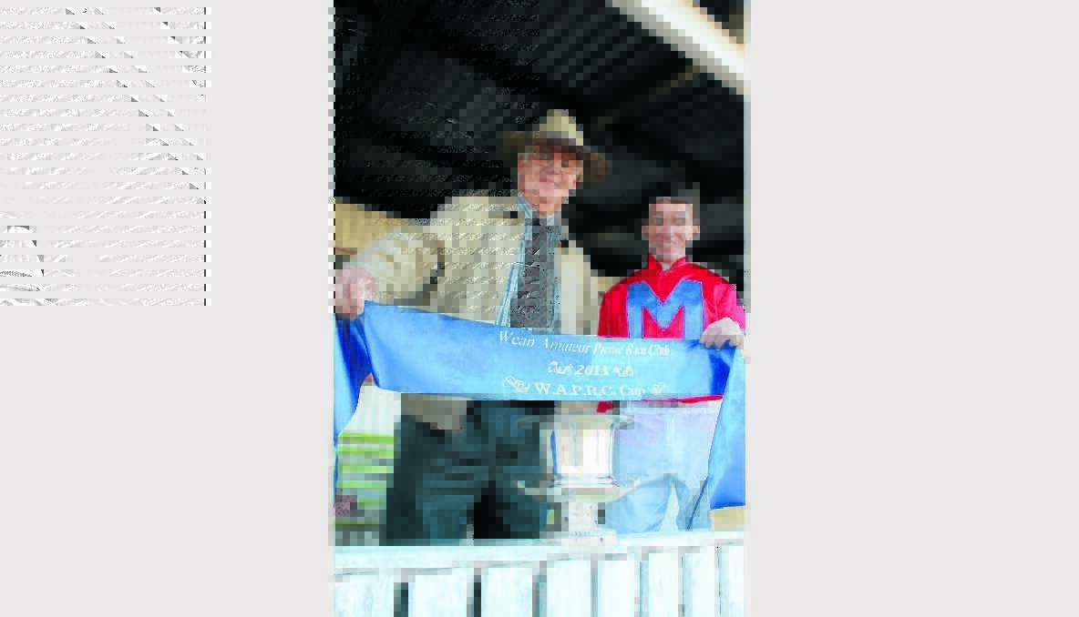 Saint Lenny part owner, Geoff Hunt, with jockey Ricky Blewitt after winning the Wean Cup on Saturday. Photo: Sam Woods, Namoi Valley Independent.