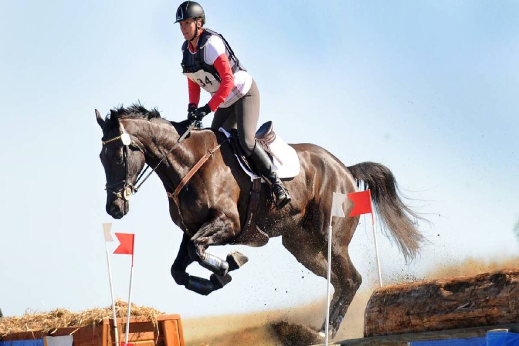 Charlotte Mavris riding Remi Wyntermere over a water jump during the cross country at the Tamworth two-day event. Photo: Gareth Gardner 070713GGB06 