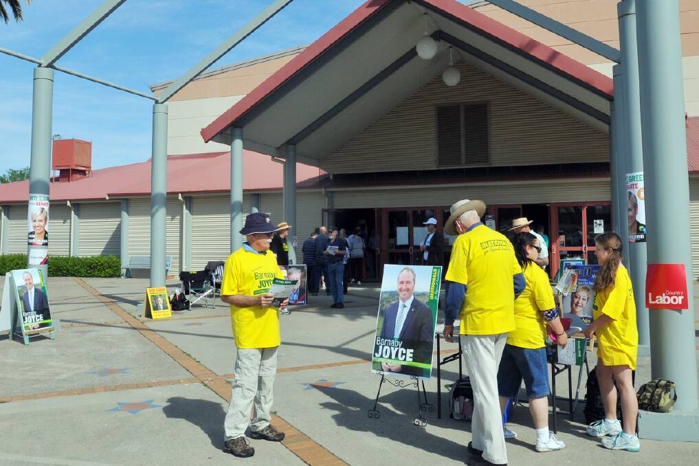 Voters and supporters outside the Tamworth Regional Entertainment and Conference Centre. Photo:Geoff O'Neill.
