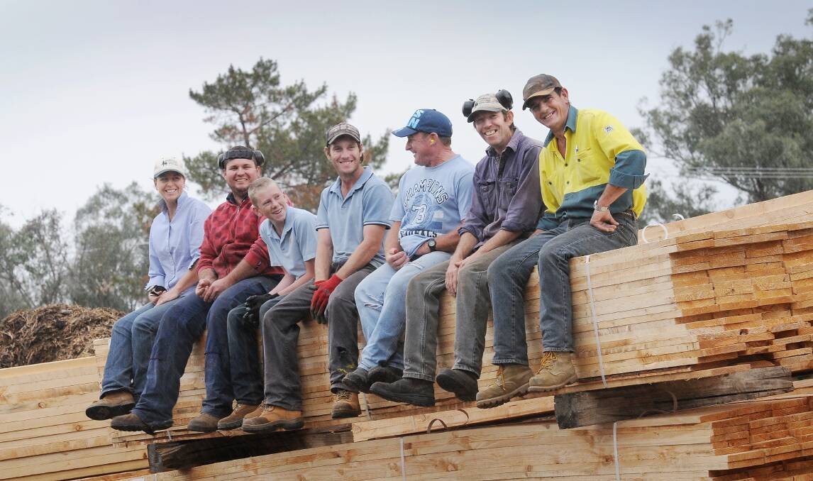 The blokes from Tamworth Treated Timbers were pretty happy their product was selected for Angelina Jolie's film, Unbroken. Photo:Gareth Gardner 170913GGB01