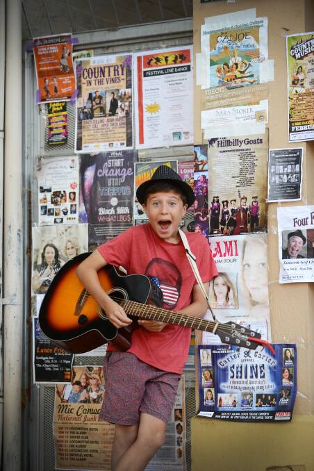 Alfie Wall at Manly was one of the buskers in Tamworth's Peel St on Tuesday. Photo:Barry Smith 210114BSB03