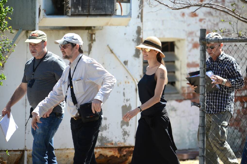 Angelina and her minders outside a Werris Creek butchery. Photo:Barry Smith
