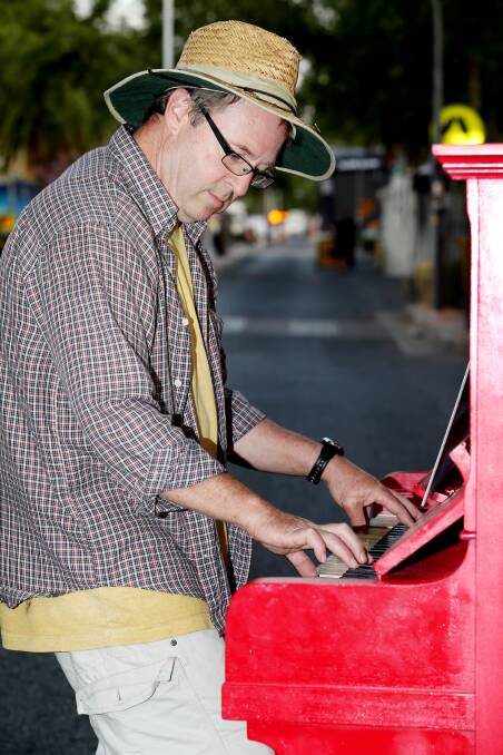 John Tucek tunes a piano in Peel St. Photo:Matt Bedford. 220114MBB01