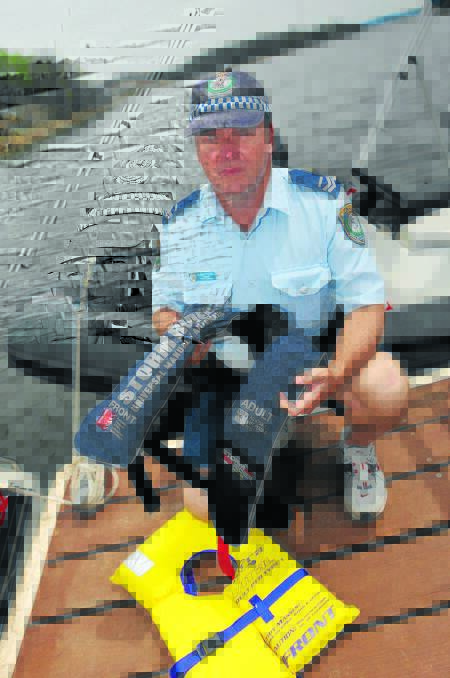 BOAT SAFETY: Oxley Senior Constable Brian Pegus on the water. Photo: Geoff O’Neill 271112GOB01