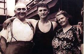 Bruce Picone with parents Jack and Madge after winning the Australian junior 110 yards freestyle swimming championship in 1945.