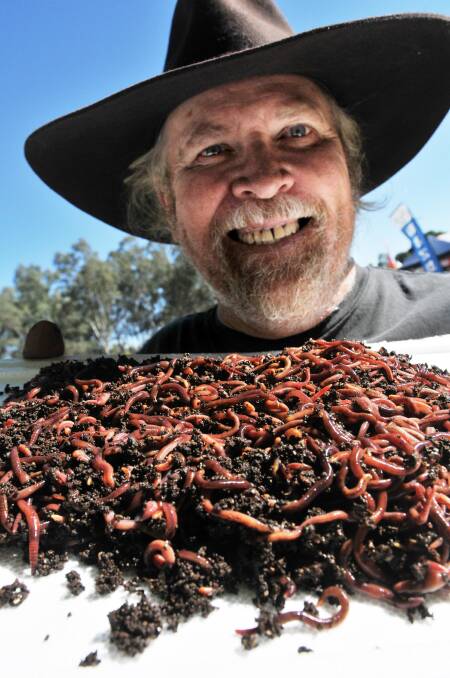 Gary Bowkett and his bucket of worms at the Sustainable Living Expo in May. Photo:Geoff O'Neill 110513GOA02