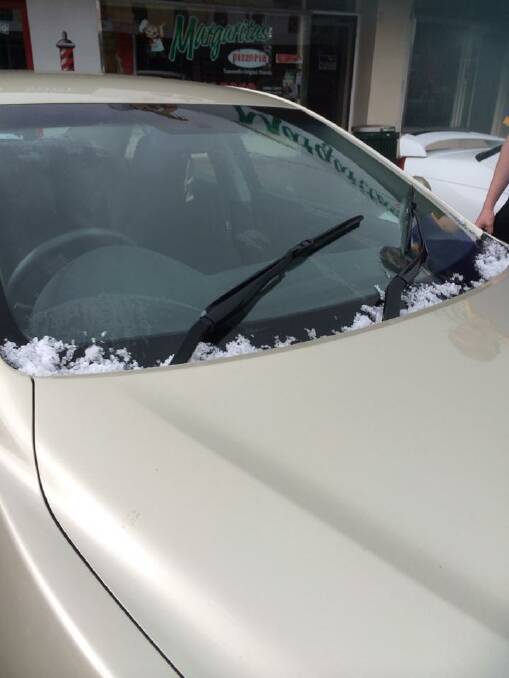 Kelly Woolfe sent us this photo of hail build up on a car.