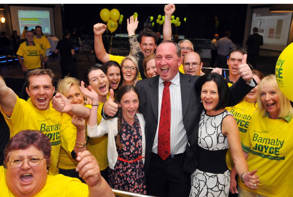 Barnaby Joyce, wif Natalie and daughter Odette celebrate Mr Joyce's win on election night with National Party supporters. 070913GOF13