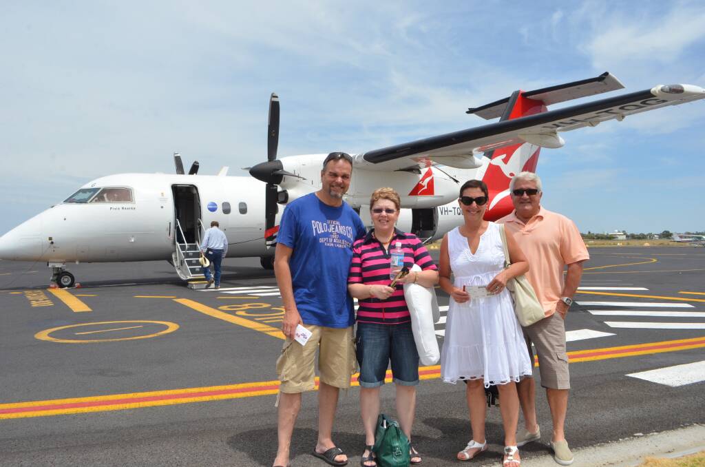 Larry and Narelle Williams along with Karen and Lachlan Smith are off to Sydney to spend Christmas with their families on the first 'official' QantasLink relief flight after the Brindabella fiasco.