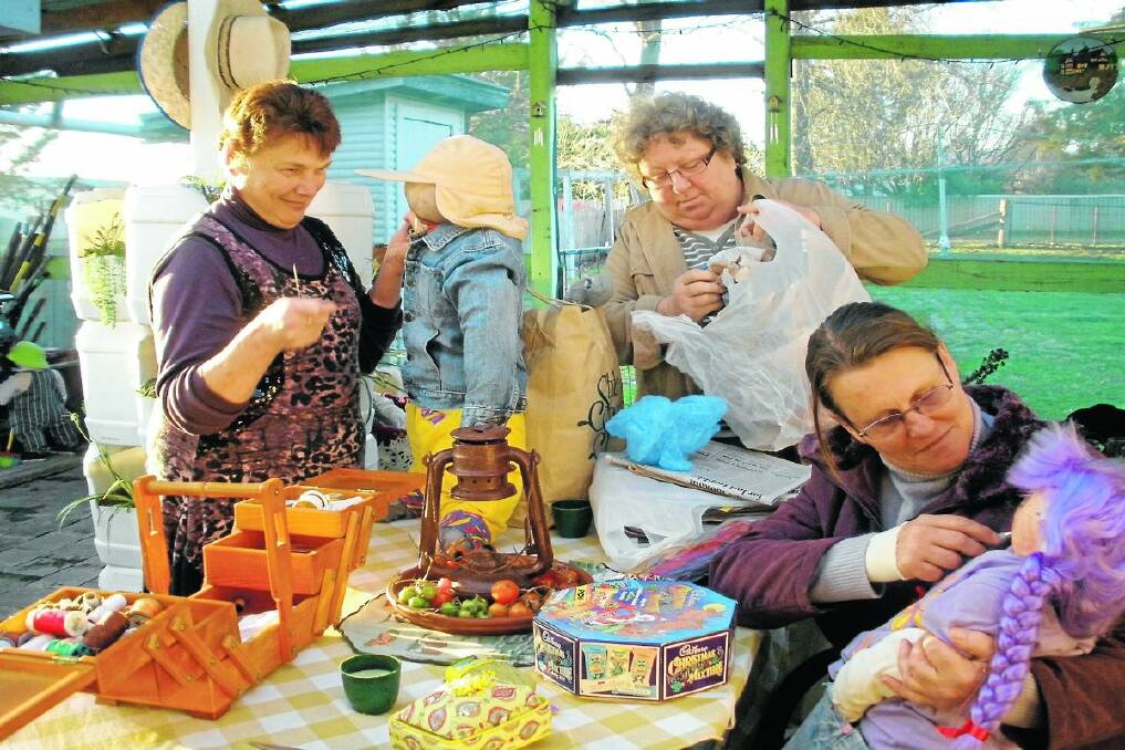 Scarey time: Sharyn Rhodes, Lesley Ball and Julie Watt work on scarecrows for the upcoming Deepwater festival. 