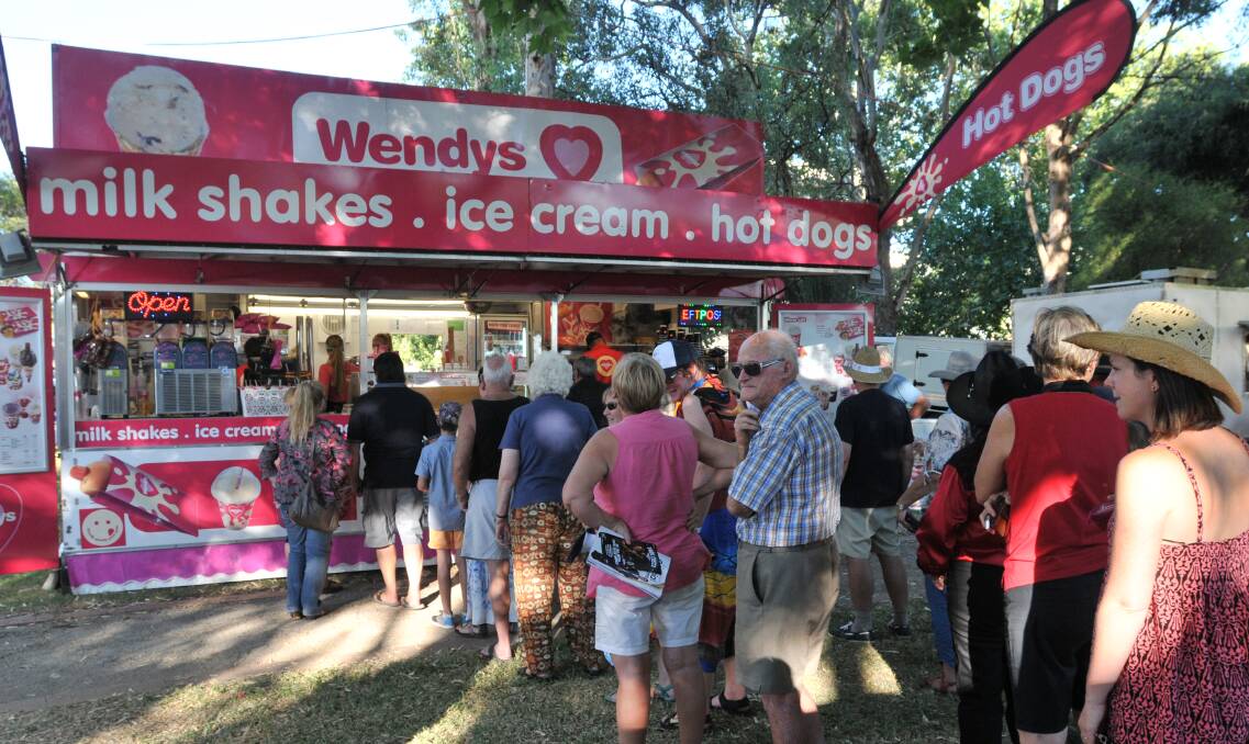 Festival goers line up for some tasty treats at Bicentennial Park.1701114GOE01