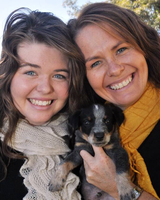 Olivia Dillon with mum Sharyn and dog Bruce at a pet show in May. Photo:Geoff O'Neill 120513GOC04
