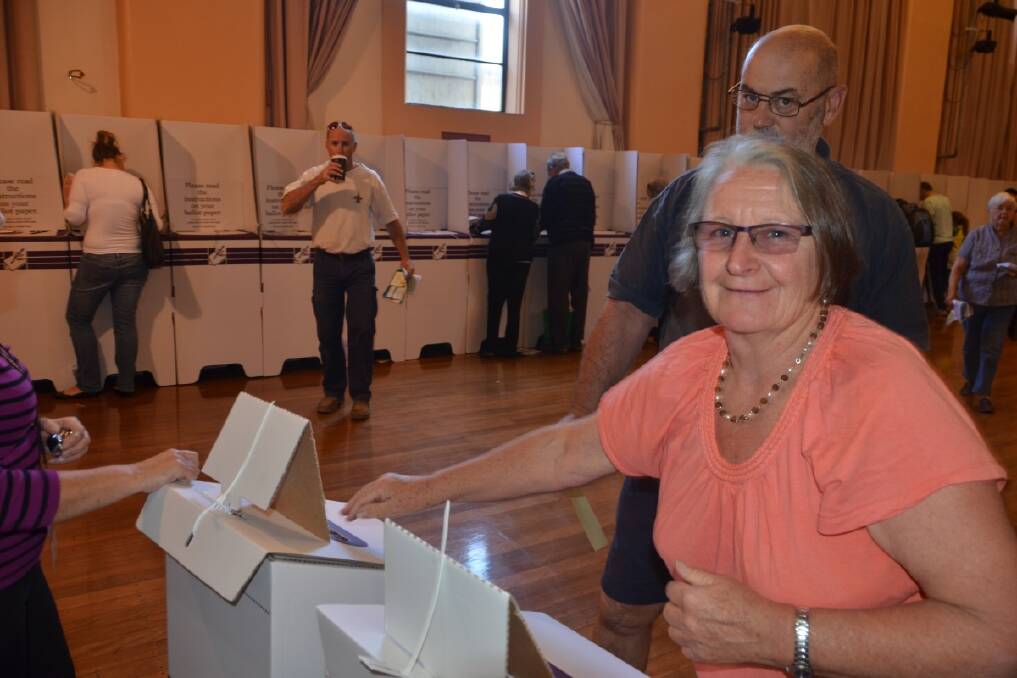 Greens candidate Pat Schultz casts her vote at the Armidale Town Hall.
