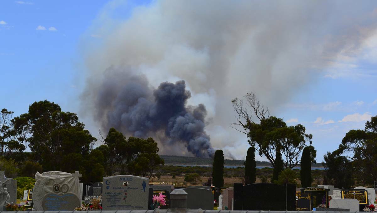 A fire burns near the Point Boston development and local abalone farms near Port Lincoln, South Australia.