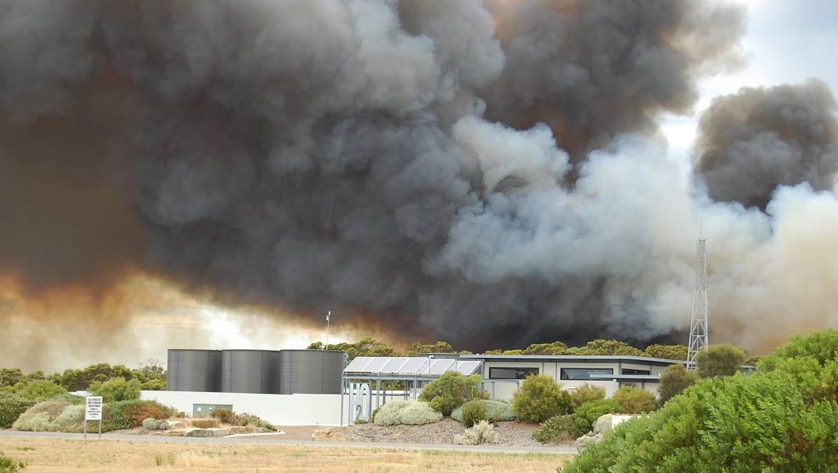 A fire burns near the Point Boston development and an abalone farms outside of Port Lincoln, South Australia.
