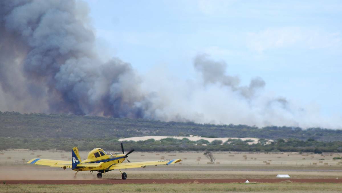 A water bomber takes off from the Port Lincoln Airport to assist firefighters at nearby Point Boston.